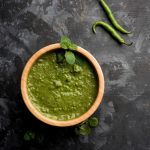 healthy-green-mint-chutney-made-with-coriander-pudina-spices-isolated-moody-background-selective-focus