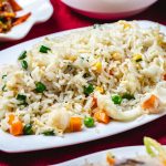 steamed-rice-with-seafood-calamary-corns-carrot-peas-side-view